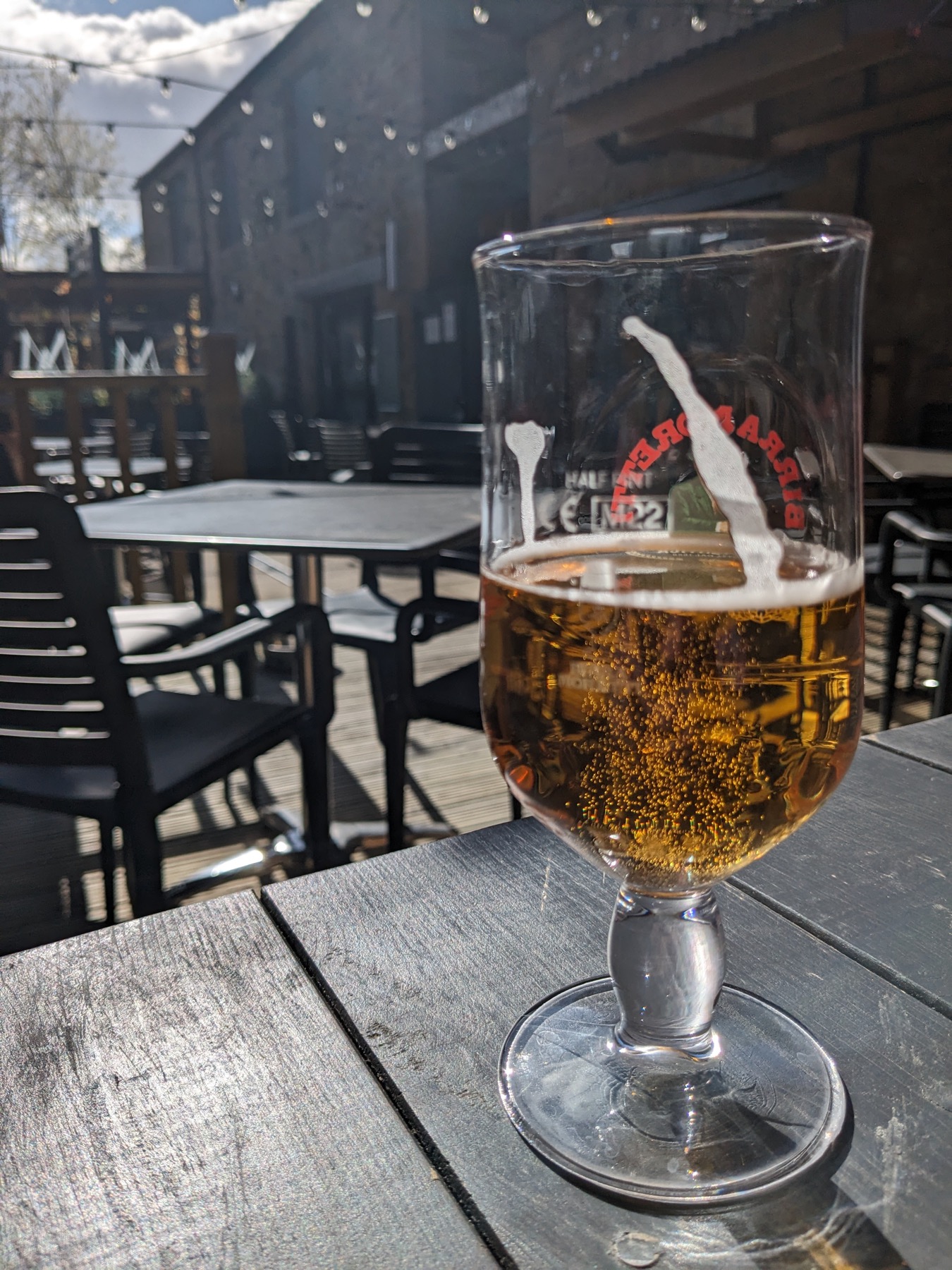 A beer enjoyed in The Milbourne Arms courtyard