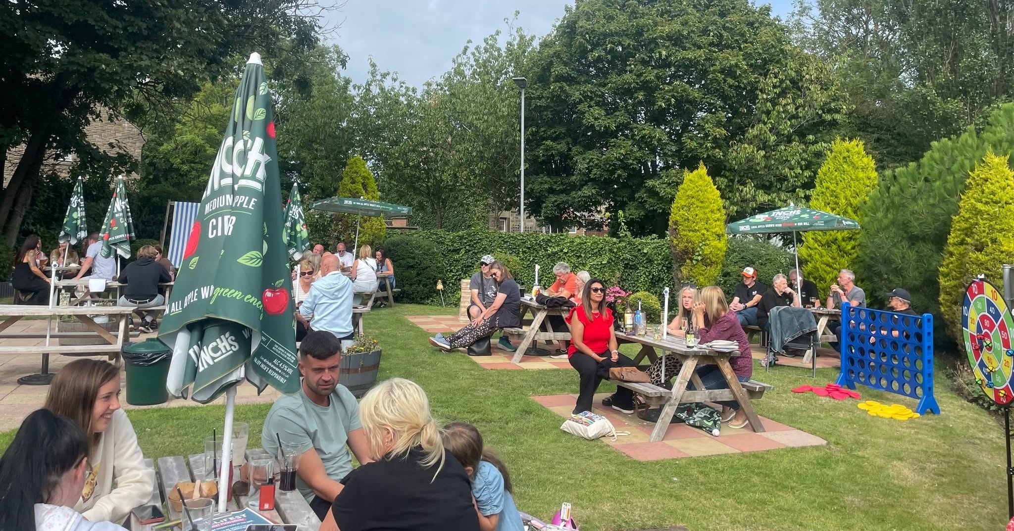 Guests enjoying MilliFest in The Milbourne Arms garden